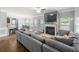 Comfortable living room with a modern fireplace and a large sectional sofa at 225 Mary Jane Ln, Covington, GA 30016