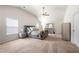 Spacious primary bedroom featuring high ceilings, natural light, and stylish, neutral-toned decor at 225 Mary Jane Ln, Covington, GA 30016