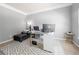 Bright home office with ample natural light, neutral colors, and modern desk at 225 Mary Jane Ln, Covington, GA 30016