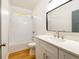 Bathroom features a white vanity, stylish mirror, shower and natural light at 2286 Carver Nw Dr, Atlanta, GA 30314