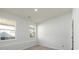 Bright, empty bedroom with two windows and a neutral carpet at 2286 Carver Nw Dr, Atlanta, GA 30314