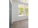 Bedroom with plush carpet, large windows and a double door closet at 2286 Carver Nw Dr, Atlanta, GA 30314