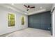 Spacious bedroom features two large windows, a ceiling fan and gray accent wall at 2286 Carver Nw Dr, Atlanta, GA 30314