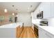 Modern kitchen features a stainless steel microwave and oven, a bright countertop and wood cabinets at 2286 Carver Nw Dr, Atlanta, GA 30314