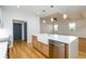 Modern kitchen with a farmhouse sink, stainless steel appliances, an island and wood cabinets at 2286 Carver Nw Dr, Atlanta, GA 30314