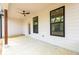 Spacious covered patio with a ceiling fan and large windows at 2286 Carver Nw Dr, Atlanta, GA 30314