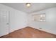 This bedroom has hardwood floors and a bright, sunny window at 313 Fayette Villa Ct, Fayetteville, GA 30214