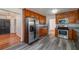 A spacious kitchen featuring stainless steel appliances, granite countertops, ample cabinetry, and a convenient layout at 313 Fayette Villa Ct, Fayetteville, GA 30214
