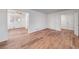 Bright and airy living room with wood flooring, large window providing ample natural light and neutral tones at 313 Fayette Villa Ct, Fayetteville, GA 30214