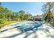 This backyard features an inground pool and slide at 313 Fayette Villa Ct, Fayetteville, GA 30214
