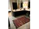 Bathroom featuring double sinks with black cabinets, tiled floors and black hardware at 5851 Swan Walk, Sugar Hill, GA 30518