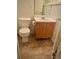Bathroom featuring a toilet, sink with vanity, and a mirror at 5851 Swan Walk, Sugar Hill, GA 30518