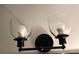 Close-up view of bathroom light fixture at 5851 Swan Walk, Sugar Hill, GA 30518