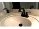 Close-up of double sinks and matte black faucets in the primary bathroom at 5851 Swan Walk, Sugar Hill, GA 30518