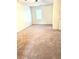 Bedroom with carpeted floors, a neutral color palette, and a window providing natural light at 5851 Swan Walk, Sugar Hill, GA 30518