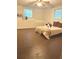 Bedroom featuring a bed with neutral bedding, two windows, and space for relaxing at 5851 Swan Walk, Sugar Hill, GA 30518