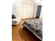 The bedroom offers a cozy sitting area and three white doors at 5851 Swan Walk, Sugar Hill, GA 30518