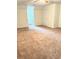 Spacious bedroom featuring plush carpet, a ceiling fan, and a window for lots of natural light at 5851 Swan Walk, Sugar Hill, GA 30518