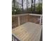Enclosed and inviting screened porch with a scenic view of the property's backyard at 5851 Swan Walk, Sugar Hill, GA 30518