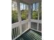 Relaxing screened sunroom providing peaceful views at 5851 Swan Walk, Sugar Hill, GA 30518