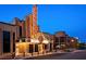 Striking theater exterior featuring a lighted marquee and brick facade with nearby street parking at 5851 Swan Walk, Sugar Hill, GA 30518