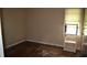Shot of a bedroom with hardwood flooring and natural light streaming through the window at 6232 Hospital Way, Douglasville, GA 30134
