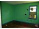 View of the bedroom with green painted walls and a window AC unit at 6232 Hospital Way, Douglasville, GA 30134