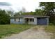 View of the light blue one story home featuring white shutters and a spacious front yard at 6232 Hospital Way, Douglasville, GA 30134