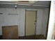 View of a room featuring a light, door, and minimal decor at 6232 Hospital Way, Douglasville, GA 30134