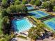 Aerial view showcasing the community pool and tennis courts at 7405 Richmond Way, Cumming, GA 30040