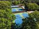 Community featuring multiple tennis courts surrounded by mature trees at 7405 Richmond Way, Cumming, GA 30040