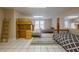 Spacious basement bedroom featuring multiple beds, a desk and tile flooring at 7405 Richmond Way, Cumming, GA 30040