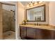 Bathroom featuring granite vanity and stone tile shower at 7405 Richmond Way, Cumming, GA 30040