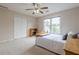 Bright bedroom with a large window, carpet flooring, and ample closet space creates a comfortable retreat at 7405 Richmond Way, Cumming, GA 30040