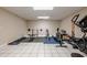 The in-home gym is fully equipped with weights and fitness machines at 7405 Richmond Way, Cumming, GA 30040