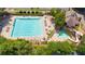 Aerial view of a large community pool with lap lanes, a kiddie pool and a waterslide at 7405 Richmond Way, Cumming, GA 30040