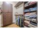 Spacious walk-in closet with custom shelving and ample storage at 7405 Richmond Way, Cumming, GA 30040