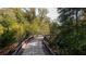 A paved walking trail surrounded by lush trees and greenery, providing a scenic route for recreation at 7405 Richmond Way, Cumming, GA 30040