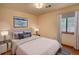 Comfortable bedroom with natural light, a plush bed, and a serene ambiance for relaxation at 2140 Teri Ln, Conyers, GA 30013