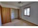 Cozy bedroom with built-in closet and a ceiling fan at 2140 Teri Ln, Conyers, GA 30013