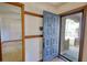 Inviting foyer with coat hooks, an open doorway and a glimpse of the outdoors at 2140 Teri Ln, Conyers, GA 30013