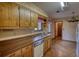 Spacious kitchen with wooden cabinets and vintage-style appliances at 2140 Teri Ln, Conyers, GA 30013