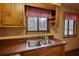 Kitchen sink featuring stainless steel fixtures and a window view at 2140 Teri Ln, Conyers, GA 30013