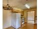 Kitchen with wood-look floors, white appliances, and wood cabinets at 2140 Teri Ln, Conyers, GA 30013
