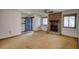 Comfortable living room features a stone fireplace and blue front door at 2140 Teri Ln, Conyers, GA 30013