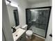 Bathroom features a glass shower, updated vanity with sink, and modern black fixtures at 437 Collier Ridge Nw Dr, Atlanta, GA 30318