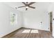 Cozy bedroom features wood-look floors, white walls, and a window with natural light at 437 Collier Ridge Nw Dr, Atlanta, GA 30318