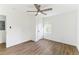 Cozy bedroom featuring wood-look floors, white walls and a ceiling fan at 437 Collier Ridge Nw Dr, Atlanta, GA 30318