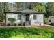Charming single-story home with updated siding, landscaping, and a welcoming front entrance at 437 Collier Ridge Nw Dr, Atlanta, GA 30318