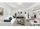 Bright and open living area with hardwood floors, and adjoins dining and kitchen at 437 Collier Ridge Nw Dr, Atlanta, GA 30318